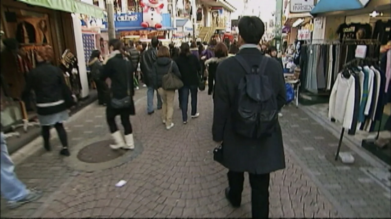 White Light/Black Rain: The Destruction of Hiroshima and Nagasaki (2007) movie still: medium — A narrow pedestrian street in Japan is crowded with…