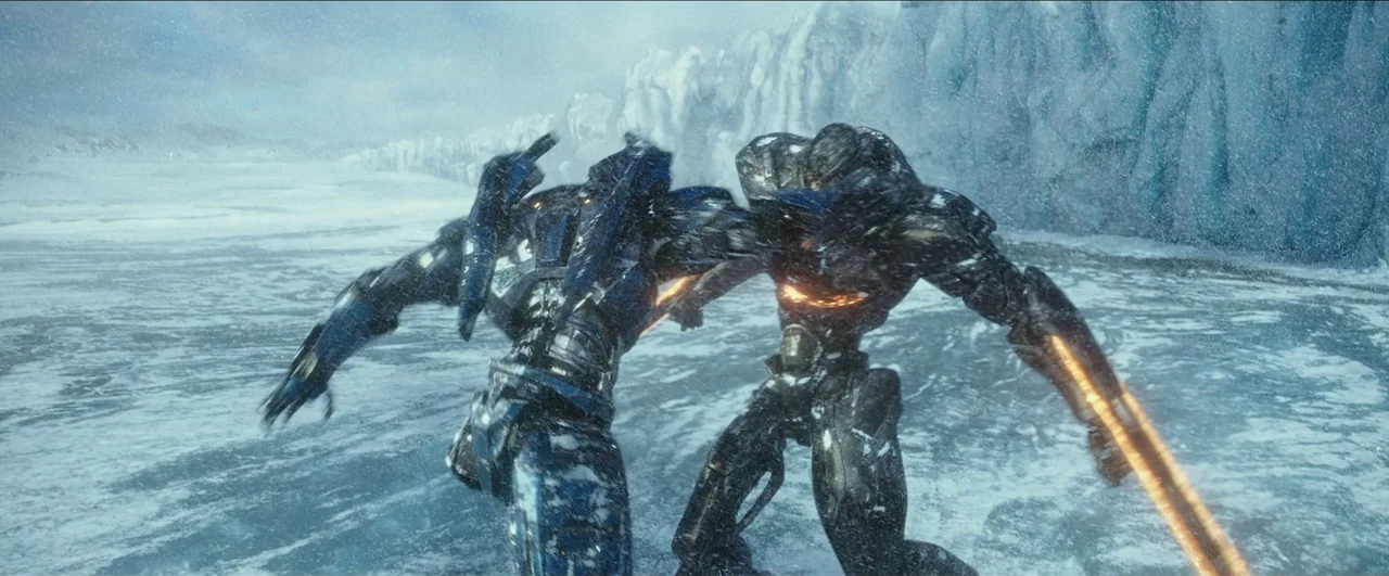 Pacific Rim: Uprising (2018) movie still: fullbody — A vast, frozen expanse featuring snow-covered ice fields and distant glacial cliffs. Two…