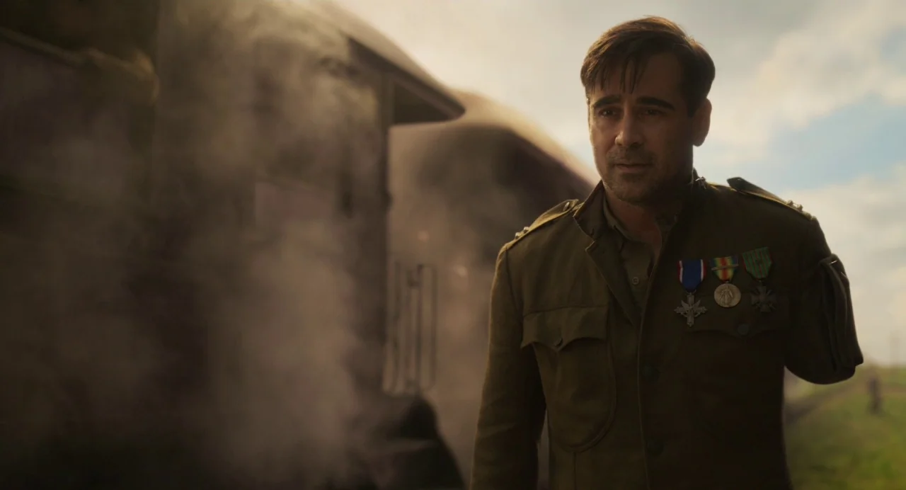 Dumbo (2019) movie still: medium — A man in a military uniform walks outdoors next to a steaming locomotive train. Smoke billows from the train…
