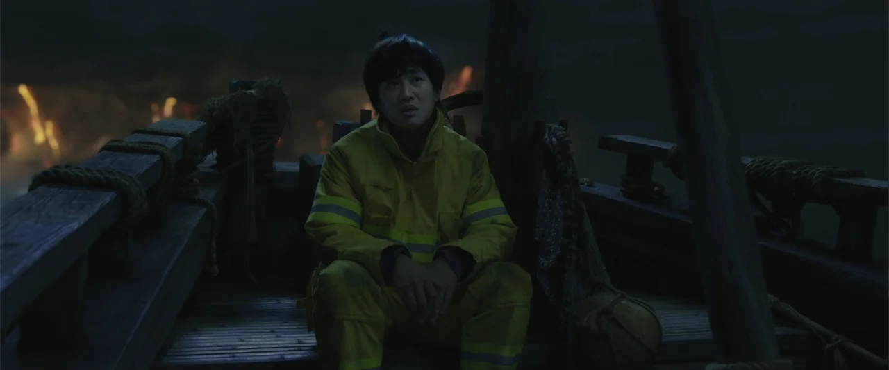 Along with the Gods: The Two Worlds (2017) movie still: medium — A dark wooden boat deck at night features ropes and fishing nets hanging nearby. A…