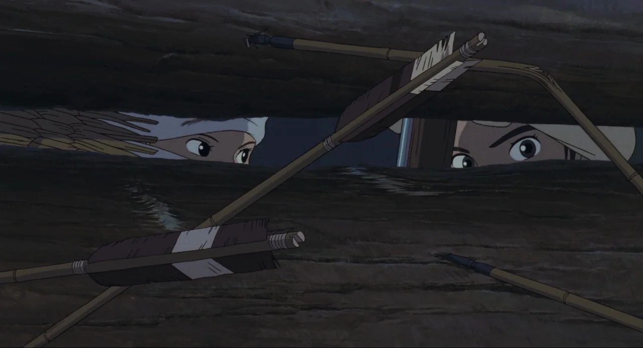 Princess Mononoke (1997) movie still: closeup — A dark wooden structure features a horizontal gap between heavy logs. Two individuals peer through…