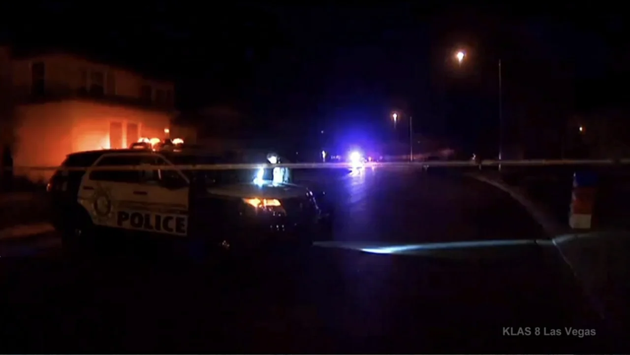 Requiem for the Dead: American Spring 2014 (2015) movie still: wide — A quiet suburban street at night is blocked off by yellow police caution tape.…