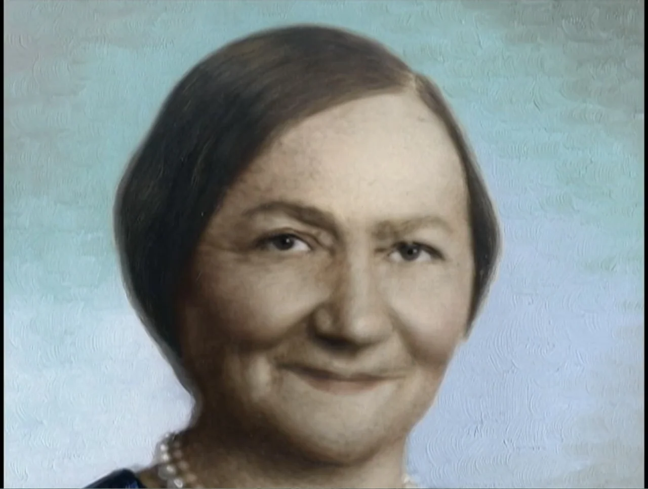 First Cousin Once Removed (2012) movie still: closeup — A formal studio portrait features an older woman against a textured pale blue background.…