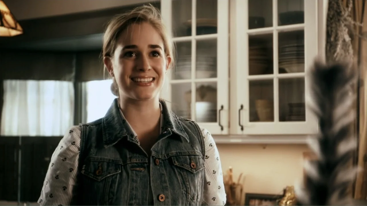 Sophie & Sheba (2010) movie still: medium — A residential room features white framed cabinets and light-colored walls in the background. A woman in…