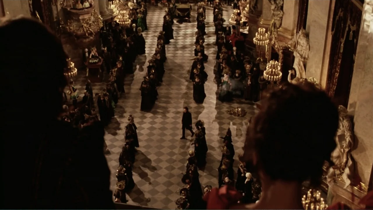 Van Helsing (2004) movie still: wide — A grand ballroom features a large checkerboard floor and ornate classical architectural details. A lone…