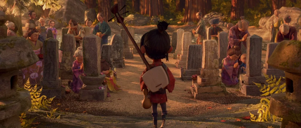 Kubo and the Two Strings movie still: fullbody — A crowded Japanese cemetery features rows of ancient stone grave markers nestled among tall trees.…