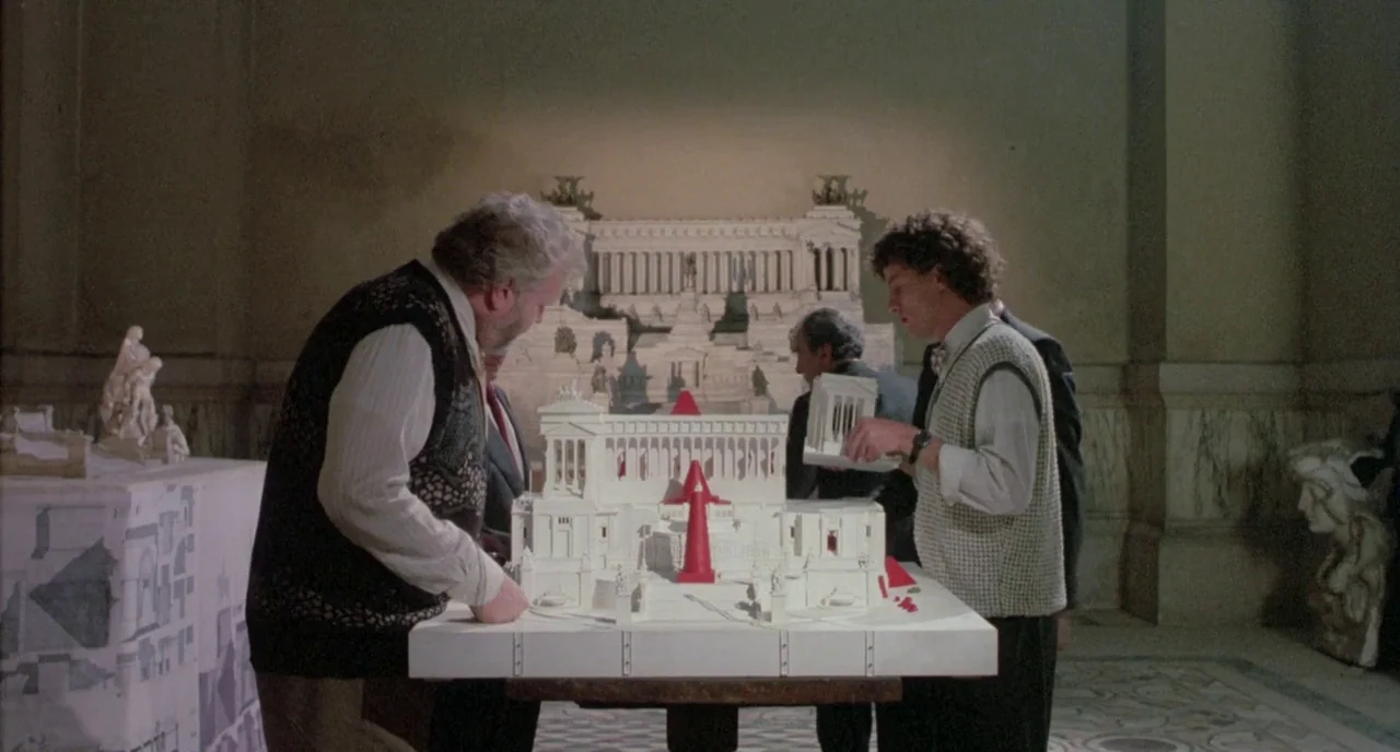 The Belly of an Architect (1987) movie still: medium — A high-ceilinged room features marble floors and various classical statues and architectural…