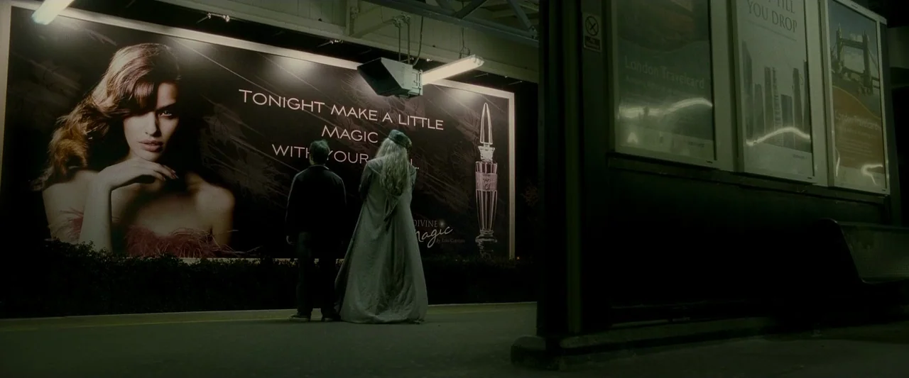 Harry Potter & The Half Blood Prince (2009) movie still: fullbody — A dark, dimly lit subway station platform at night with rows of advertising…