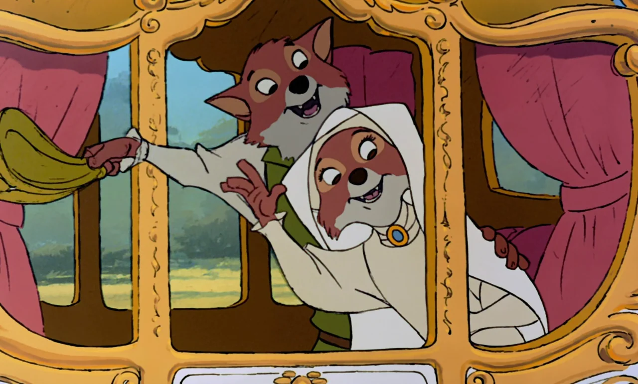 Robin Hood (1973) movie still: medium — An anthropomorphic fox couple sits inside a golden horse-drawn carriage with red curtains. The pair smiles…