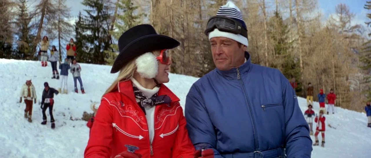 For Your Eyes Only (1981) movie still: medium — A snow-covered mountain slope is populated with numerous skiers in colorful winter clothing. A woman…