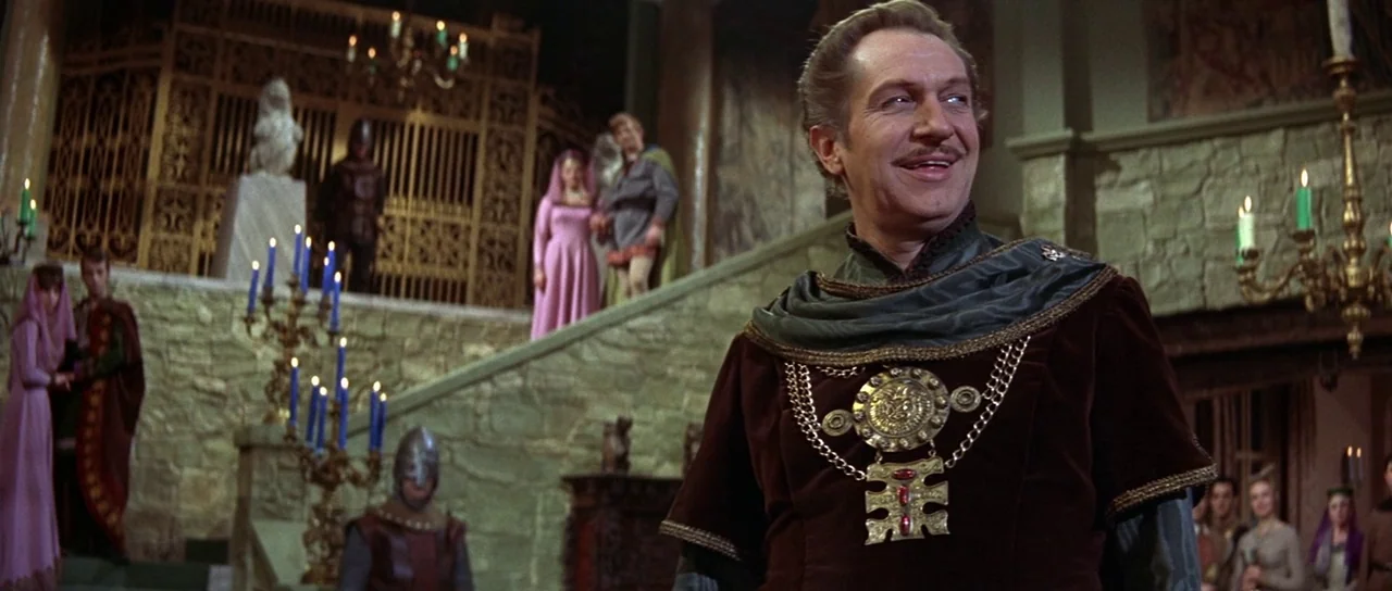 The Masque of the Red Death (1964) movie still: medium — A stone castle interior features a grand staircase and ornate golden metal screens. An…