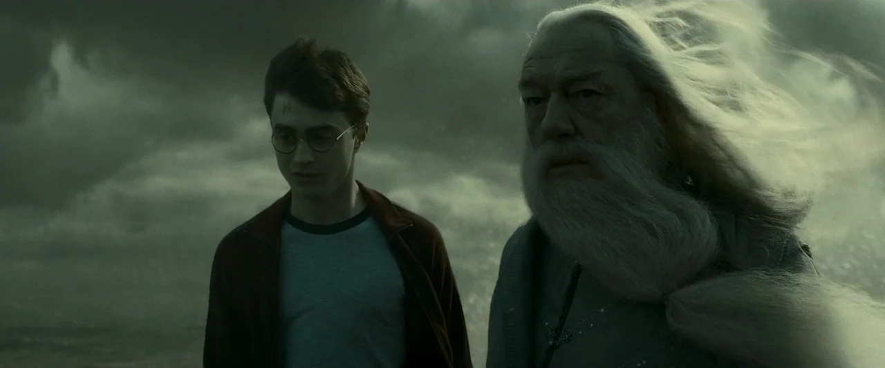 Harry Potter & The Half Blood Prince (2009) movie still: medium — A stormy, dark seaside location at night with grey, churning water and cloudy…