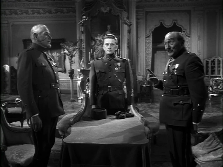 Paths of Glory (1957) movie still: fullbody — An ornate interior room with wood paneling and decorative wall molding features three men. They stand…