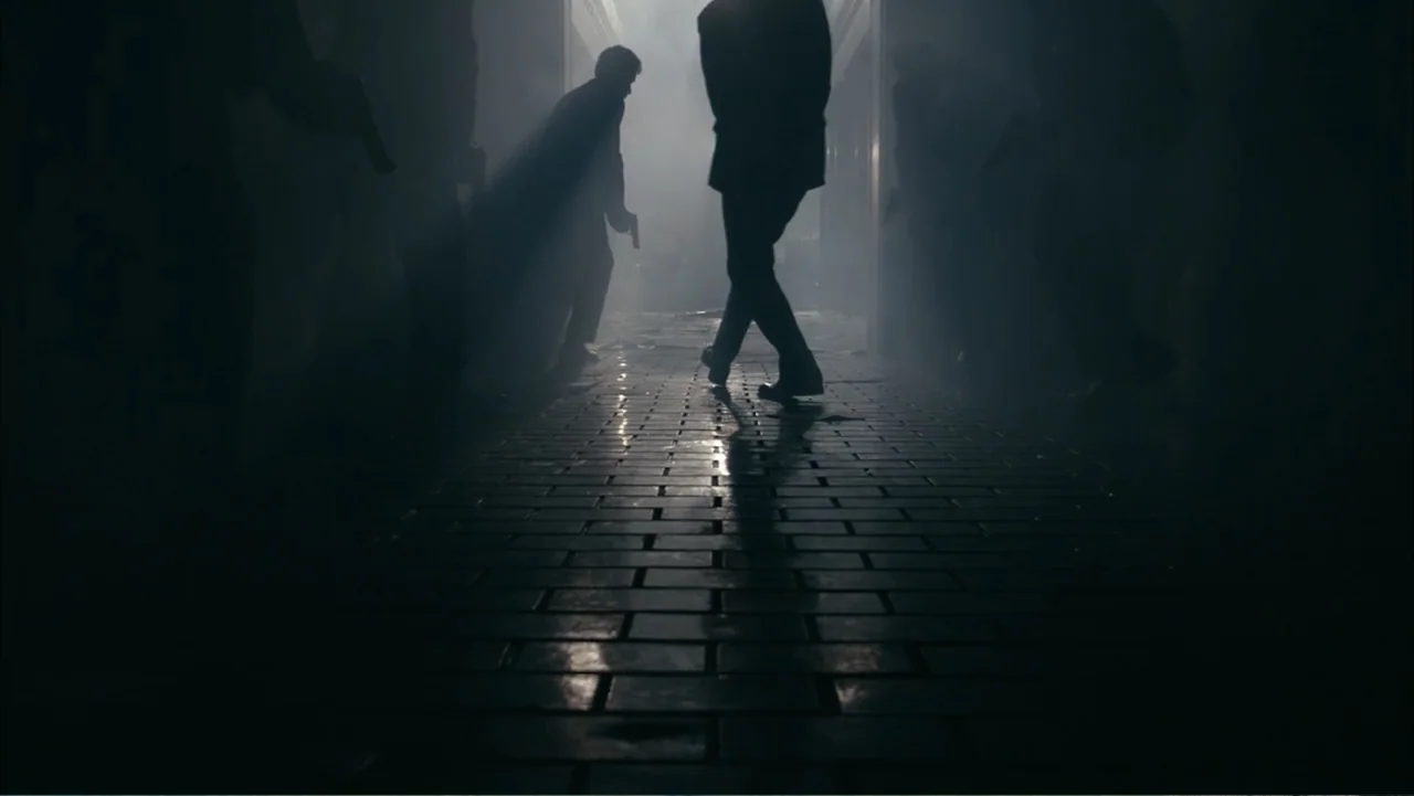 Get Smart (2008) movie still: fullbody — A dark, smoke-filled corridor features a brick floor and silhouettes of multiple armed individuals. A man…
