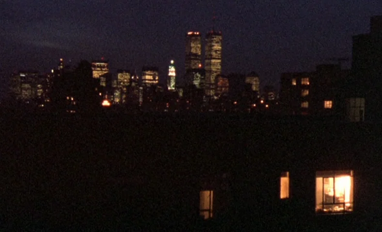 Paris Is Burning (1990) movie still: establishing — A nocturnal view of the lower Manhattan skyline featuring the World Trade Center towers.…