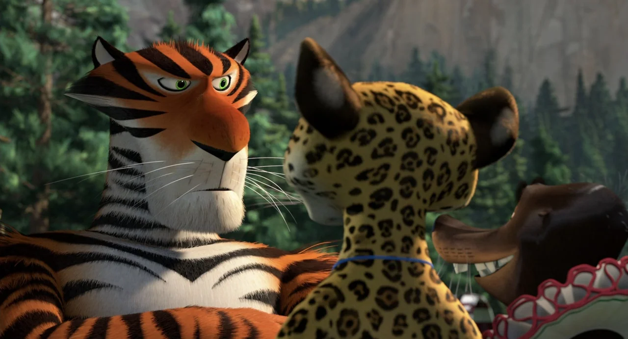 Madagascar 3: Europe's Most Wanted (2012) movie still: medium — A dense woodland with tall pine trees and a blurred mountain slope behind. A tiger…