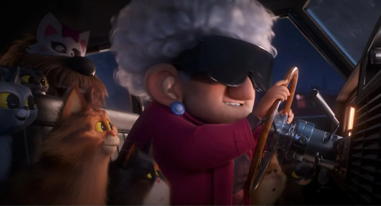 The Secret Life of Pets 2 (2019) movie still: medium — An elderly woman with white hair drives a car at night. She is surrounded by several small…
