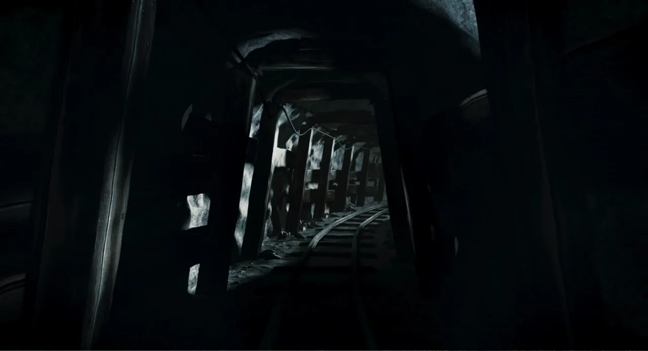 Salvation (2025) movie still: wide — A subterranean mining tunnel constructed with dark wooden support beams and gravel flooring. Railway tracks…