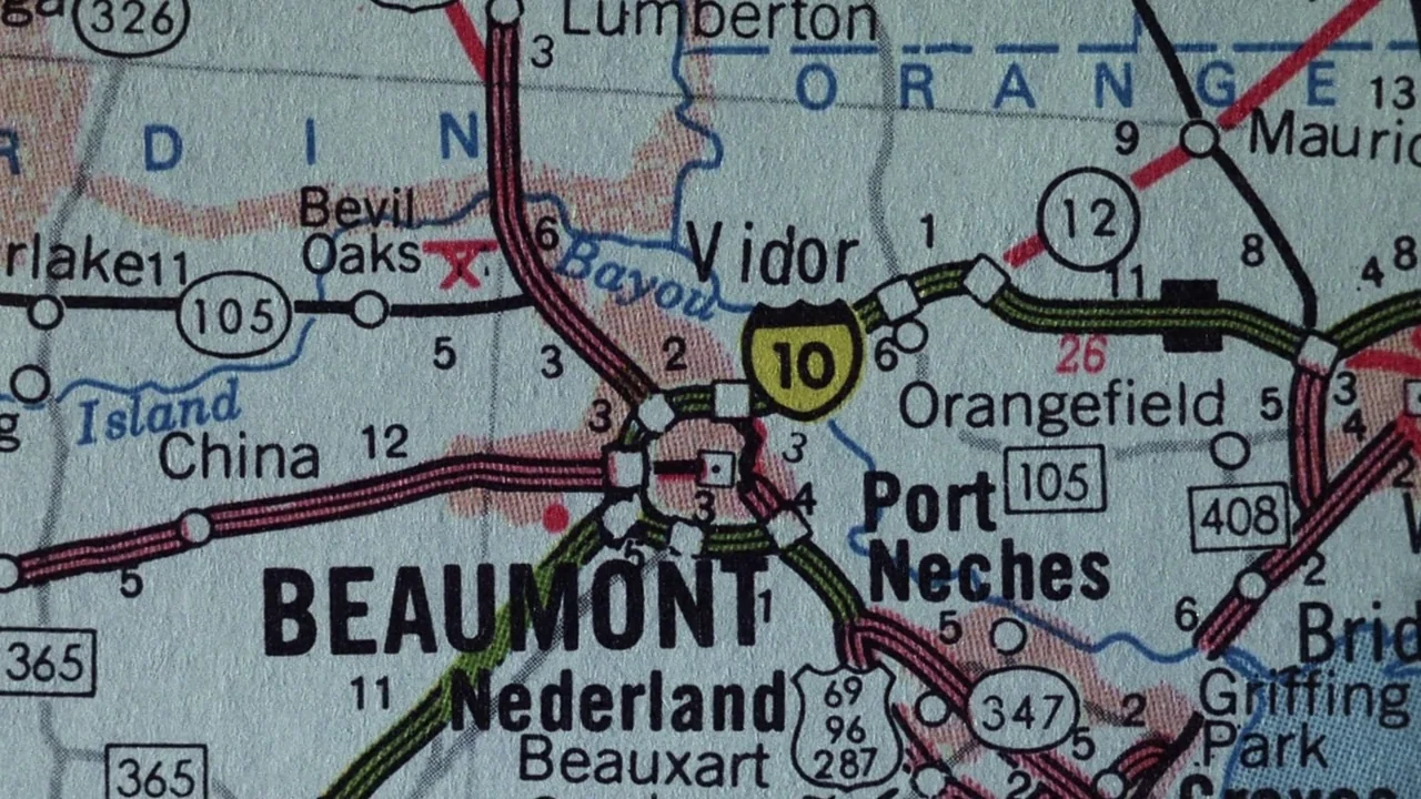 The Thin Blue Line (1988) movie still: closeup — A close-up view shows a section of a printed road map of Texas. The map features labels for cities…