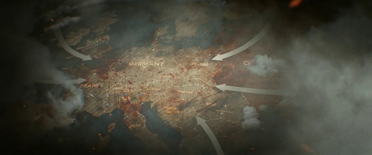 Sisu (2022) movie still: establishing — A vintage paper map of 1940s Europe is covered in red stains and smoke. White directional arrows indicate…