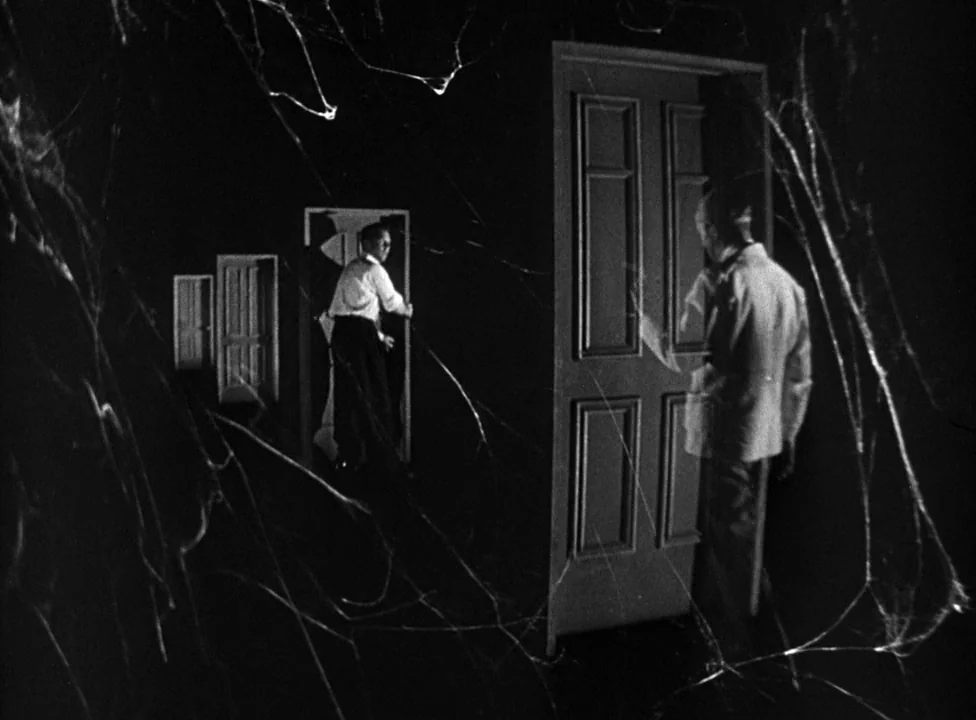 Murder, My Sweet (1944) movie still: wide — A dark, empty void features several freestanding wooden doors arranged in diminishing perspective. Two…