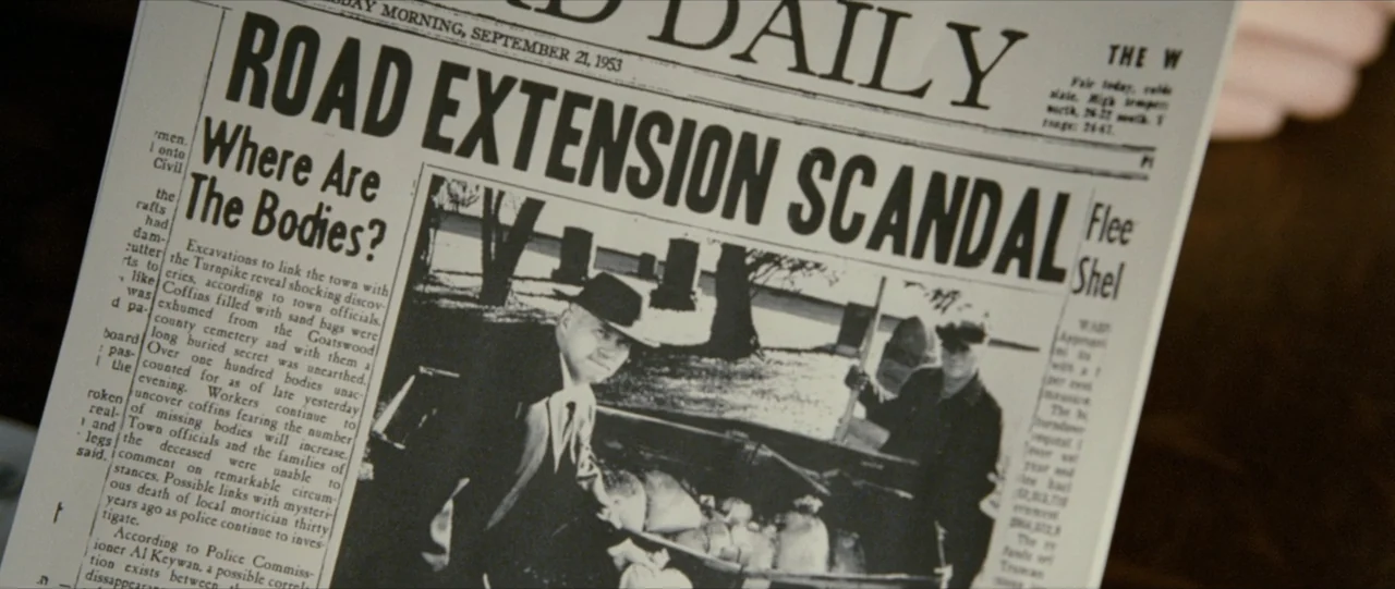 The Haunting in Connecticut (2009) movie still: closeup — A vintage 1953 newspaper is held in a person's hand. The front page features a large…