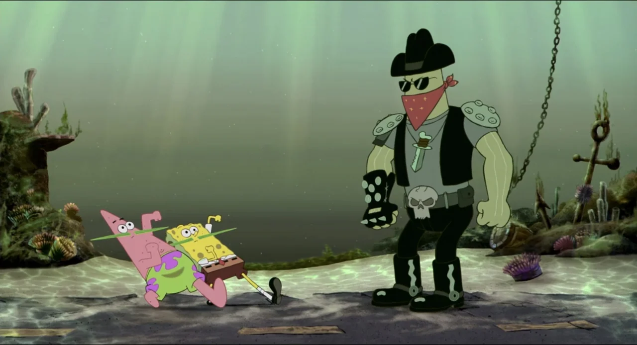 The SpongeBob SquarePants Movie (2004) movie still: wide — A sandy seabed floor rests beneath the ocean surface with scattered rocks and wreckage. A…