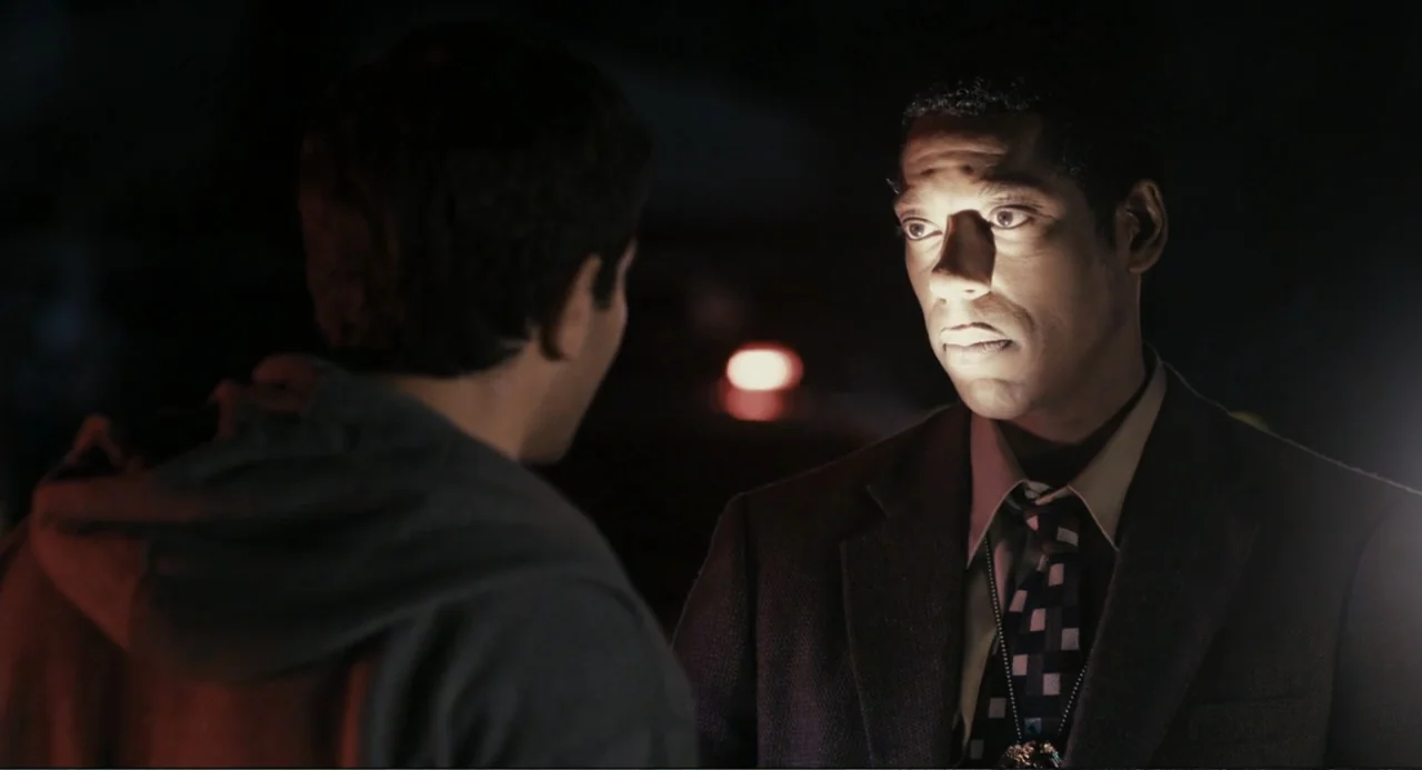 Beyond a Reasonable Doubt (2009) movie still: medium — A dimly lit outdoor location at night features a dark parking area with out-of-focus lights.…