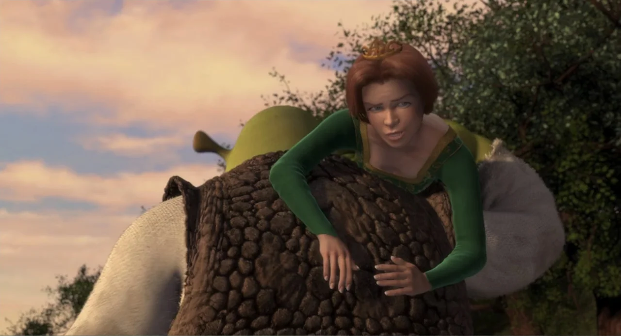 Shrek (2001) movie still: medium — A green hillside landscape is visible during the late afternoon hours under a soft sky. Fiona leans her upper…