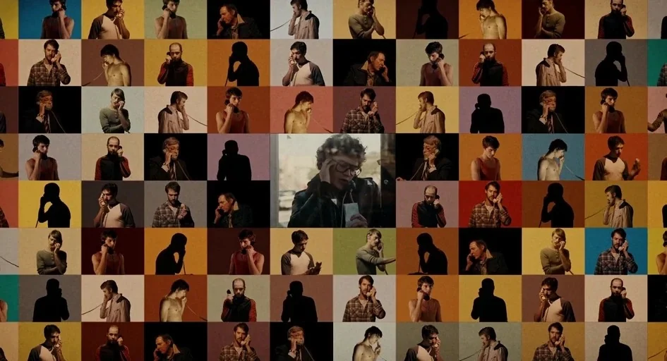 Milk (2008) movie still: wide — A mosaic grid of numerous small video frames depicting various men holding telephones. One central frame shows a man…