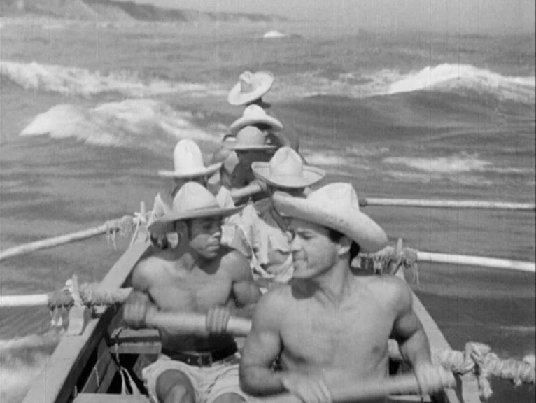 Redes (1936) movie still: medium — A wooden boat navigates choppy ocean waters on a hazy, overcast day. Five men wearing straw hats and no shirts…
