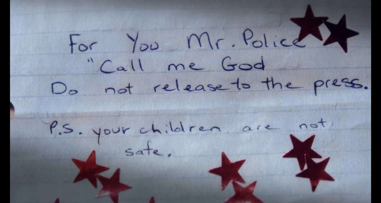 Hunted by My Husband: The Untold Story of the DC Sniper (2025) movie still: closeup — A piece of lined notebook paper contains a handwritten message…