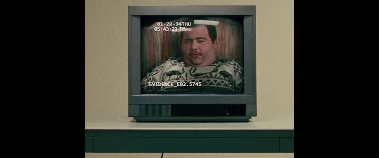 I, Tonya (2017) movie still: medium — A vintage cathode-ray tube television sits on a plain surface against a neutral wall. The screen displays a…