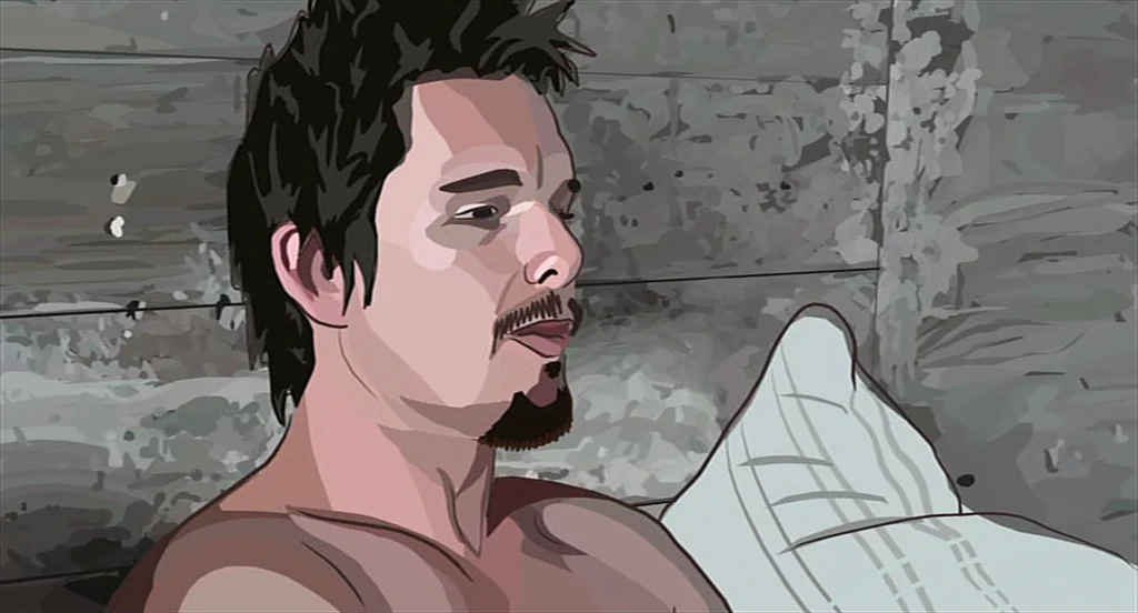 Waking Life (2001) movie still: closeup — A man lies in a bed with a white patterned pillow against a gray wall. He rests his head while looking to…