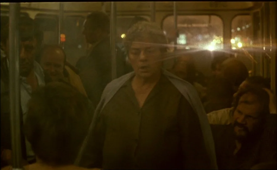 Les Amants Du Pont Neuf (The Lovers on the Bridge) (1991) movie still: medium — A crowded night bus interior with passengers silhouetted against…