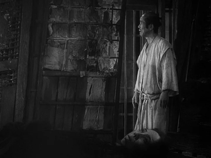 The Lower Depths (1957) movie still: medium — A traditional Japanese room features sliding paper doors with torn sections of paper screen. An…