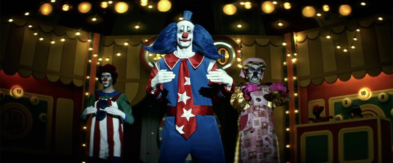 Bingo: The King of the Mornings (2017) movie still: medium — A dark game show set features illuminated circular numbers and warm glowing string…