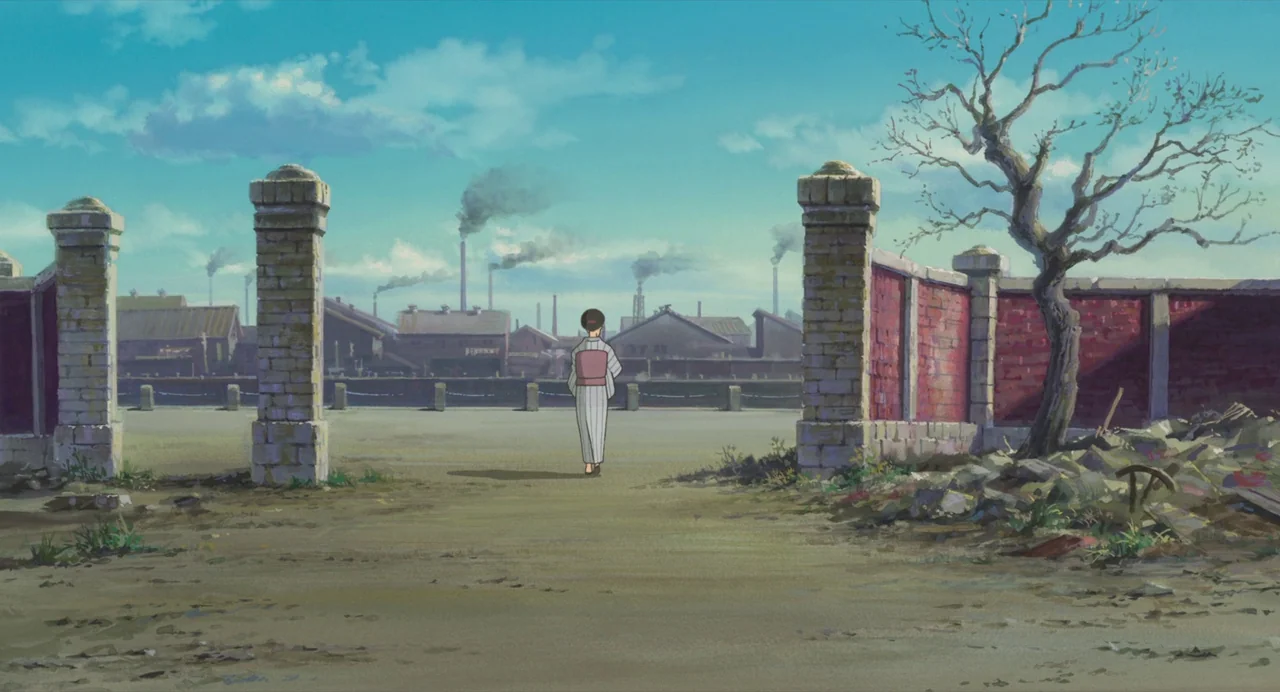 The Wind Rises (2013) movie still: fullbody — A desolate dirt lot features brick pillars and a ruined wall. A woman in traditional clothing walks…