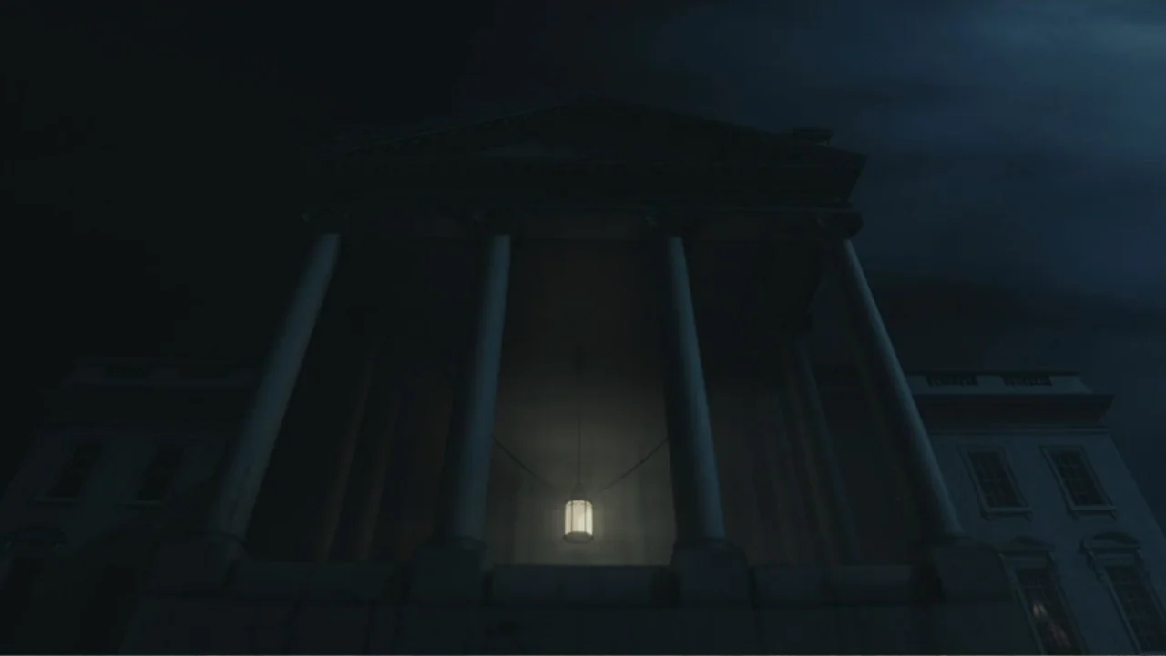 Demon in the White House (2021) movie still: establishing — A grand neoclassical stone portico with towering columns looms under a dark night sky. A…