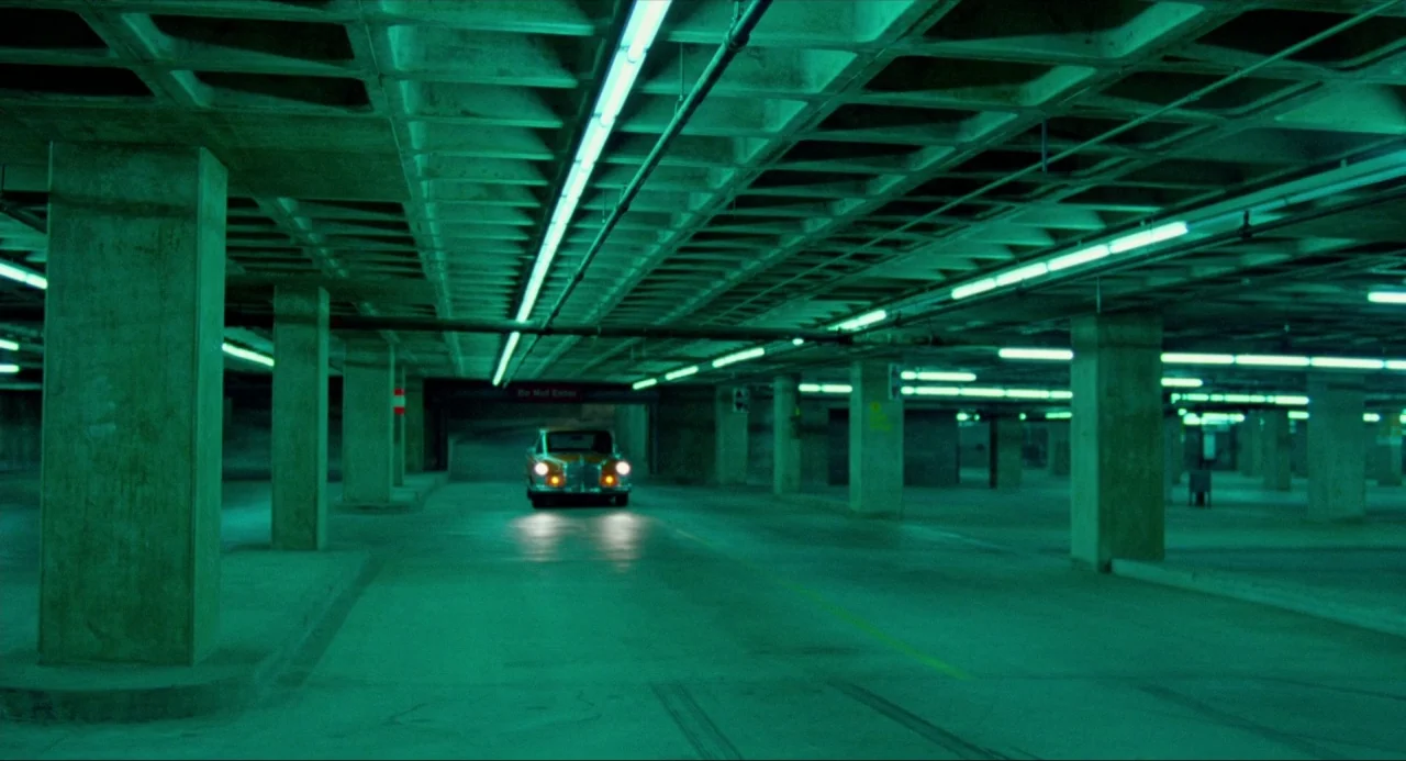 The Driver (1978) movie still: wide — An empty, expansive underground parking structure features concrete pillars and a waffle-grid ceiling. A…