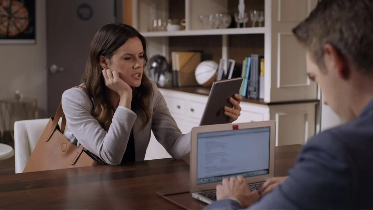 Always and Forever Christmas (2019) movie still: medium — A modern home office with wooden furniture and white built-in shelving units in…