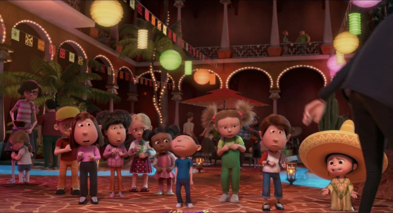 Despicable Me 2 (2013) movie still: medium — A terracotta-paved courtyard is decorated with strings of paper lanterns and hanging festive flags. A…