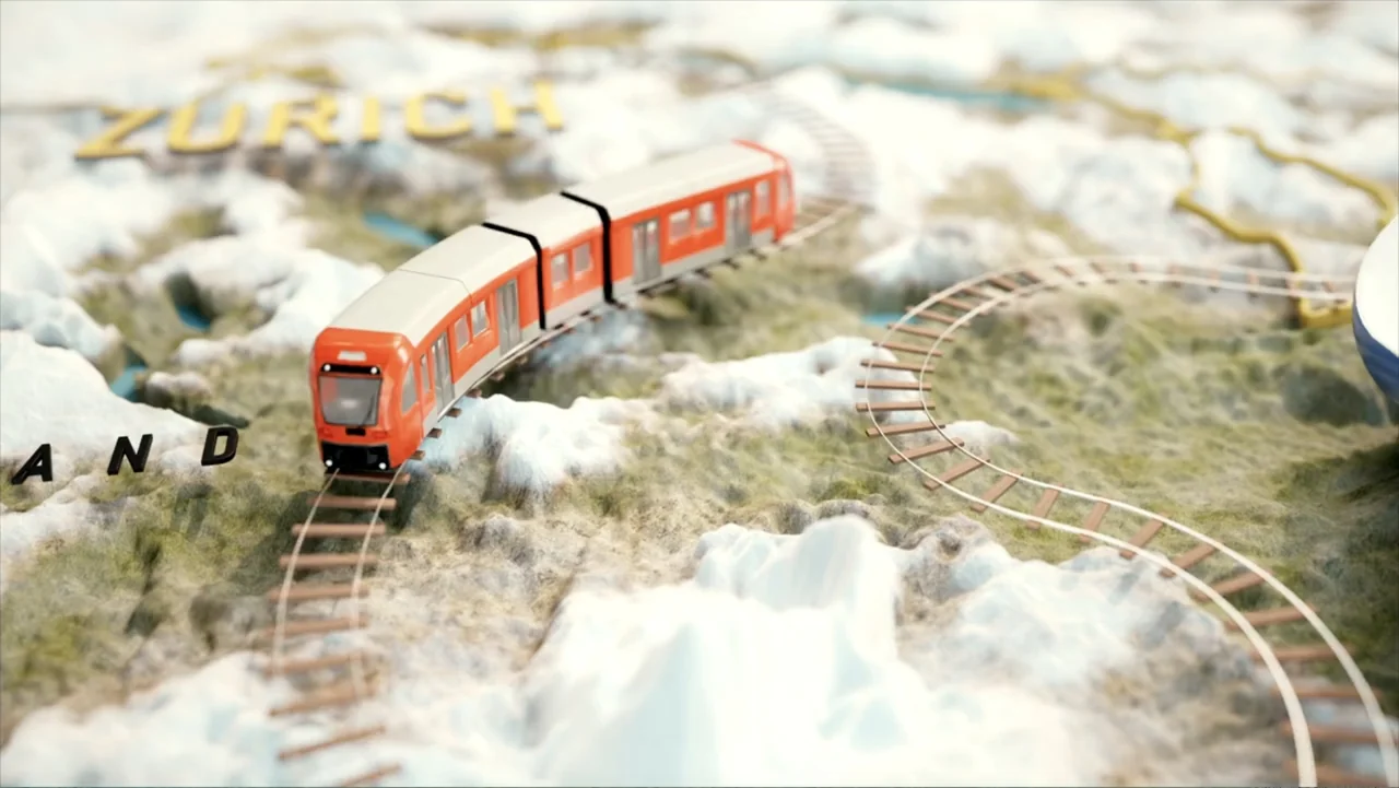 Jack in Time for Christmas (2024) movie still: wide — A stylized 3D miniature relief map of a landscape features a small red train. The train…