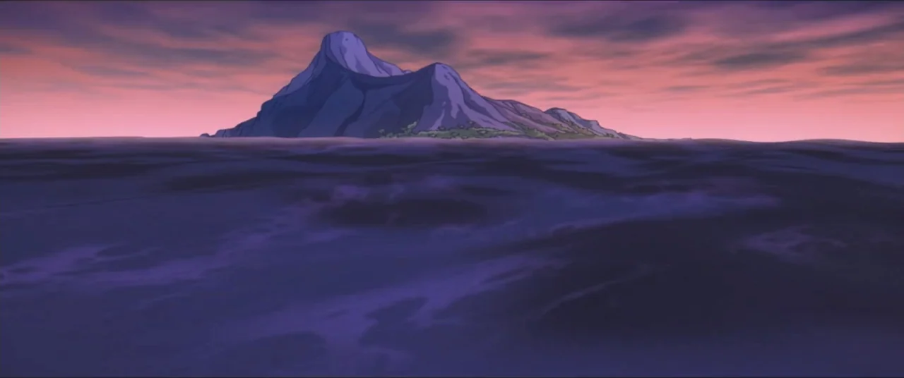 Rugrats Go Wild (2003) movie still: establishing — A rugged island mass rises from dark, rippling ocean water at twilight. A vibrant sunset sky with…
