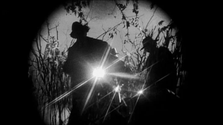 Dracula: Pages from a Virgin’s Diary (2002) movie still: medium — Dense, leafless shrubbery at night creates a dark, claustrophobic frame around two…