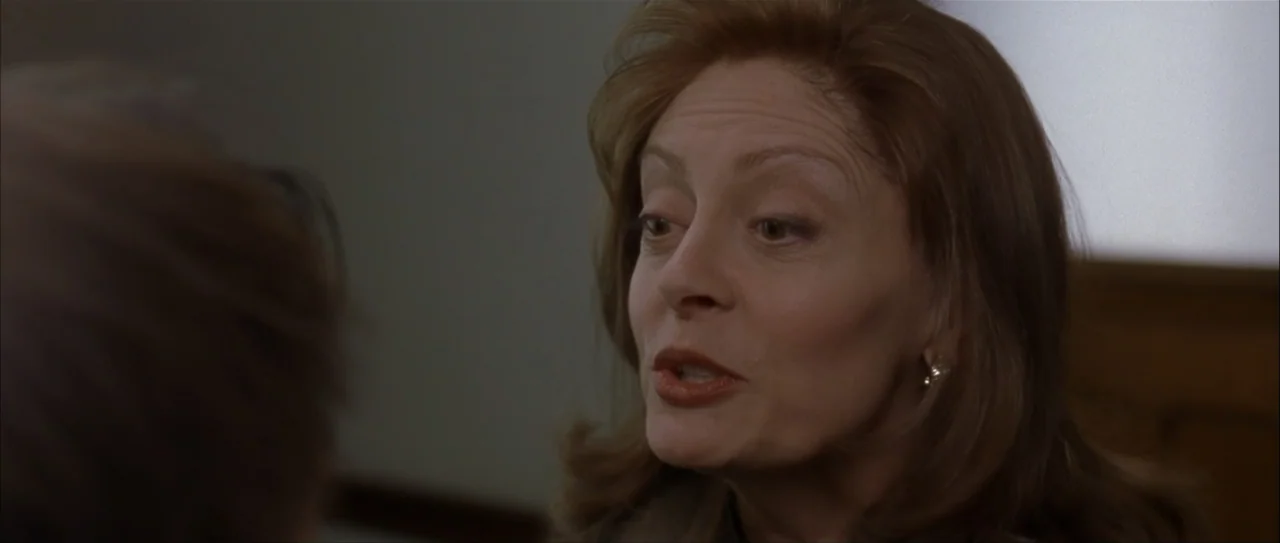 Igby Goes Down (2002) movie still: closeup — An interior space provides the backdrop for a conversation between two people. The woman faces her…