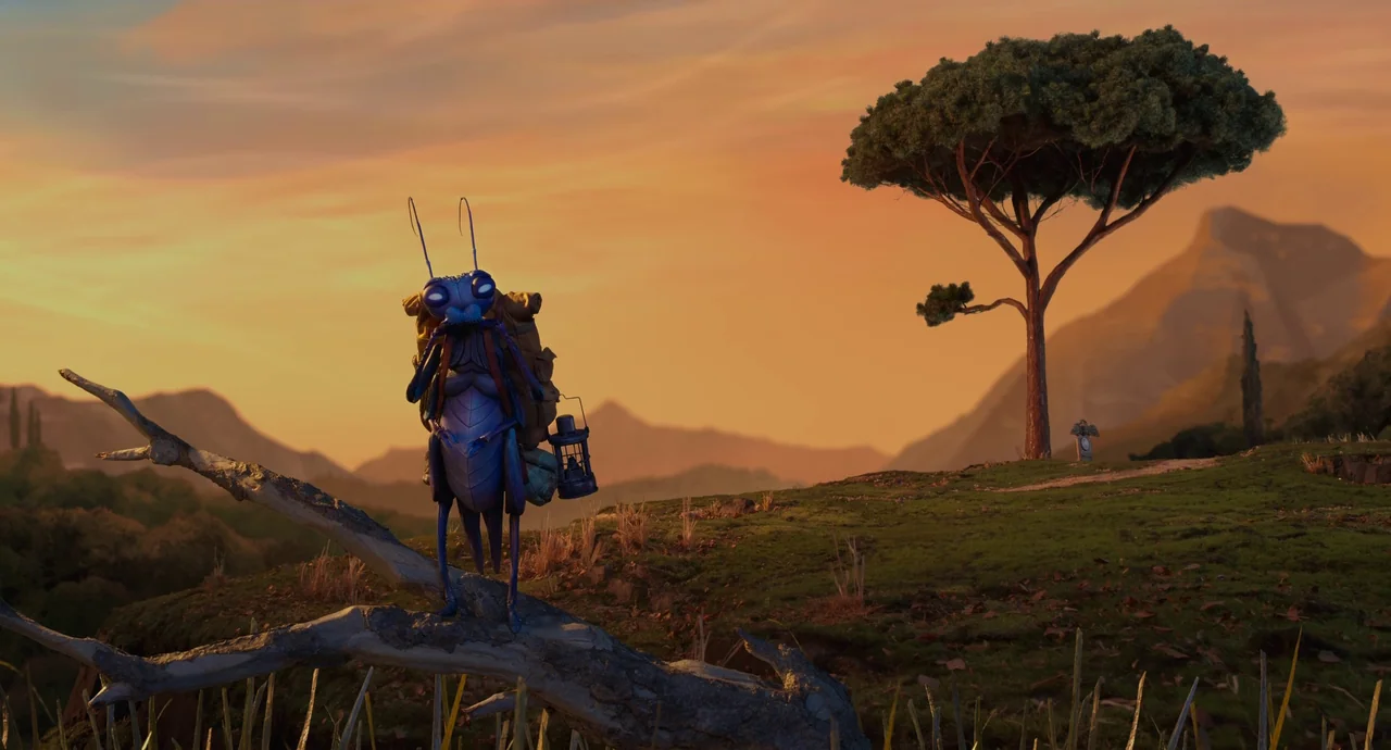 Guillermo del Toro’s Pinocchio (2022) movie still: wide — A grassy hill with a singular tree stands under a vibrant orange sunset sky. A blue…