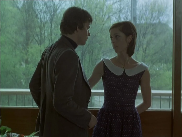Love In The Afternoon (Chloe In The Afternoon) (L’amour l’après-midi) (1972) movie still: medium — A man and a woman stand before a large window…