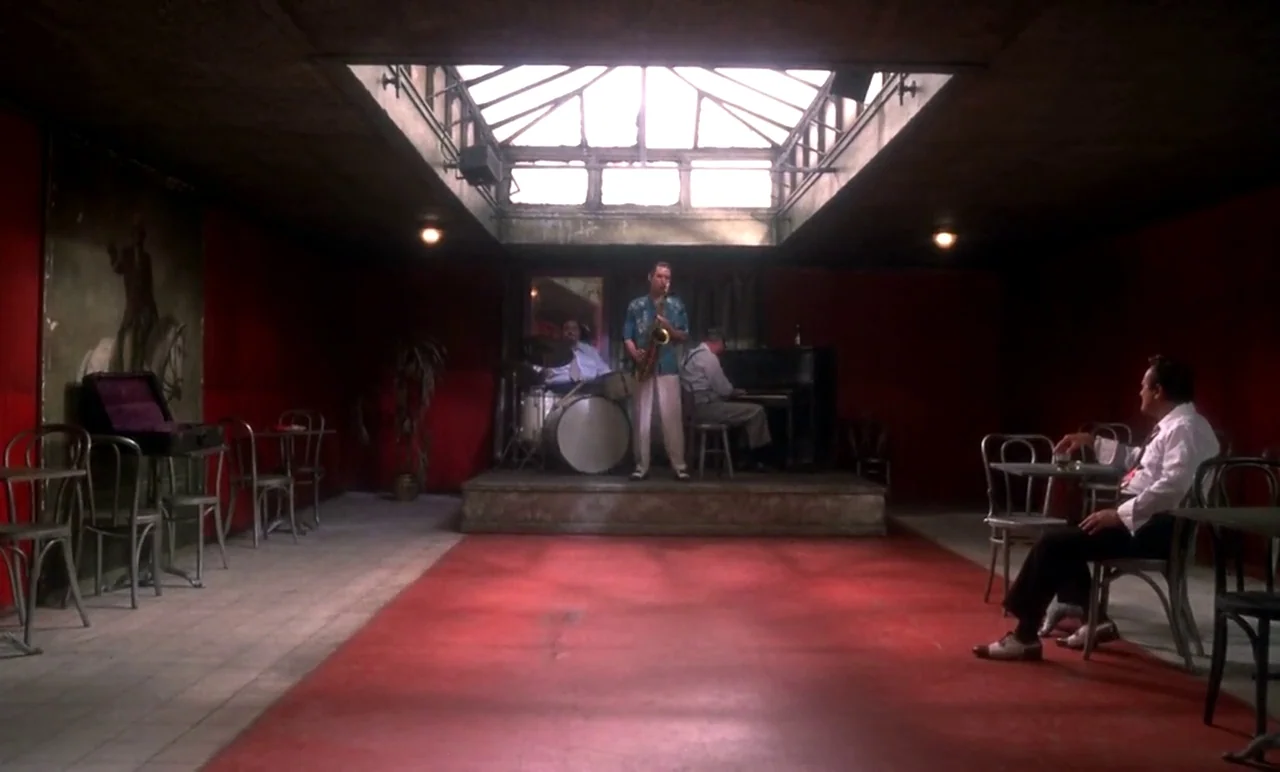 New York, New York (1977) movie still: wide — A basement-level performance space with vibrant red walls and a large rectangular ceiling skylight. A…