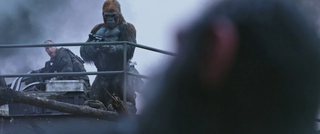War for the Planet of the Apes (2017) movie still: medium — A military platform overlooks a smoky, war-torn environment with debris and overcast…